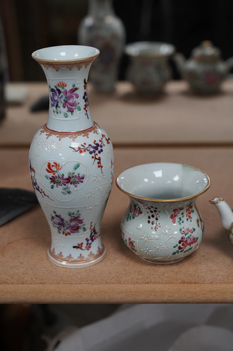 A pair of Samson armorial porcelain vases, a small Canton teapot and an armorial pot, largest 17cm high. Condition - good, teapot lid repaired